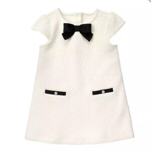 Elegant White Dress with Black Bow